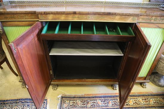 A Regency brass inset rosewood breakfront dwarf bookcase, with pierced brass three quarter gallery, two panelled and two pleated doors,